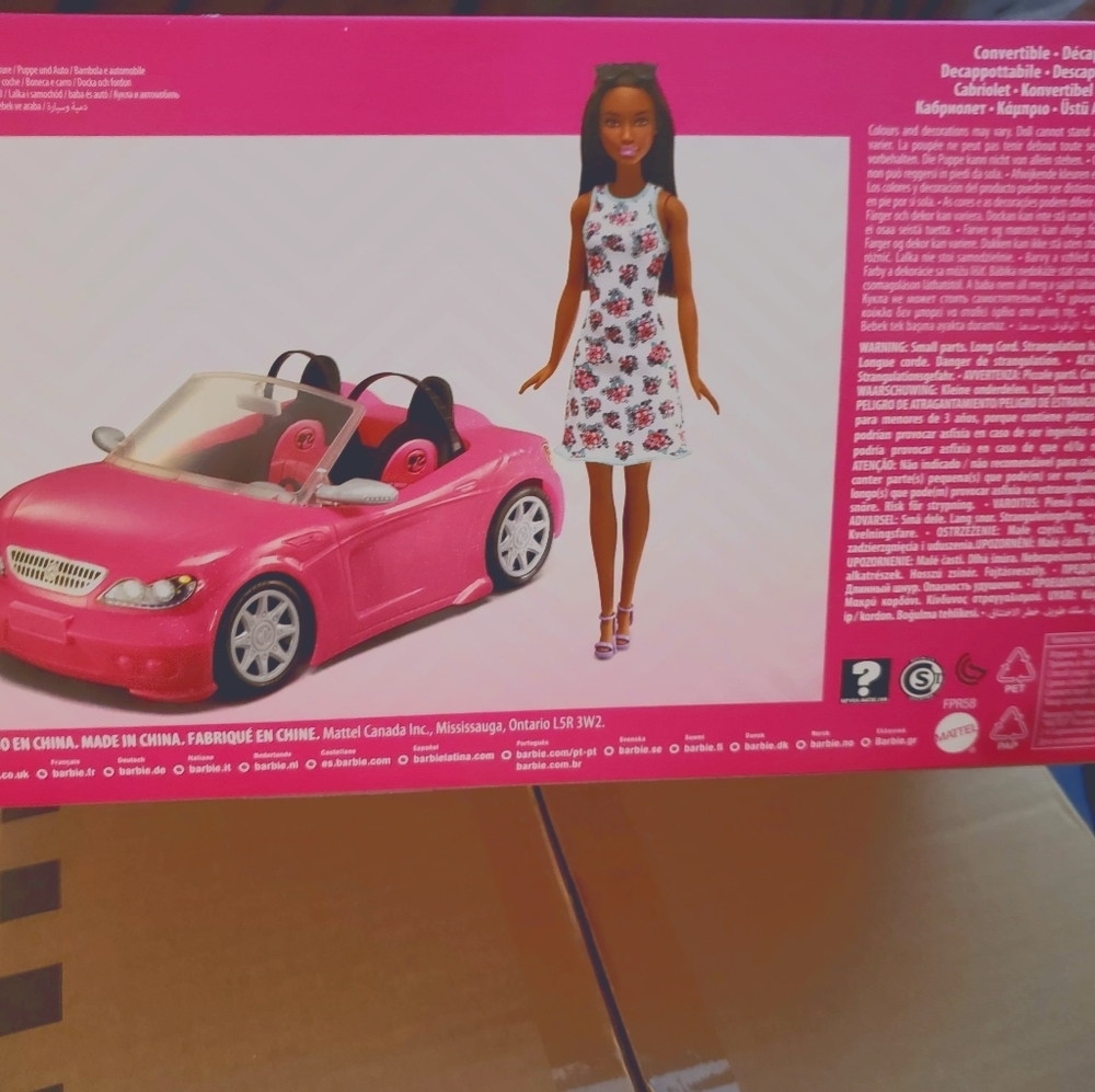 Barbie with pink convertible car
